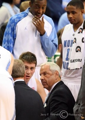 North Carolina Head Coach Roy Williams with his team during a timeout