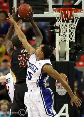 Duke G Henderson is unable to stop Florida State C Alabi from reaching the basket