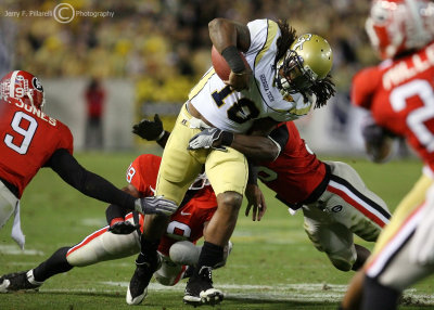Georgia Tech A-back Anthony Allen fights for yardage while surrounded by Bulldogs