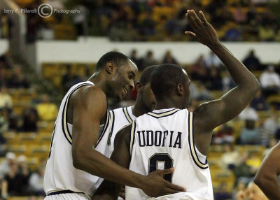 Jackets F Lawal congratulates G Udofia for drawing a foul on a drive to the basket