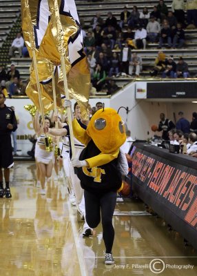 Yellow Jackets mascot Buzz leads the team onto the court