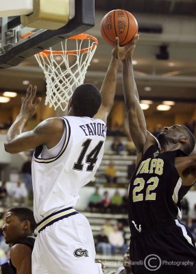 Georgia Tech F Favors goes up under the basket against the defense of UAPB F Davis