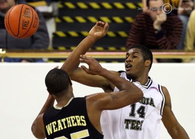 Yellow Jackets F Favors knocks the ball from the hands of Golden Lions F Weathers