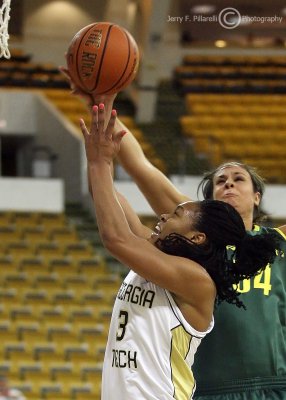 Georgia Tech G Sharena Taylor goes strong to the basket over Oregon F Canepa