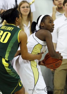 Georgia Tech G Walthour looks to pass against the defense of Oregon G Holliday