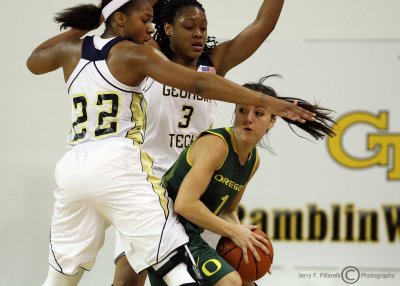 Yellow Jackets G Taylor gets help from G Montgomery as they trap Ducks G Lilly