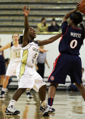 Yellow Jackets G Metra Walthour puts defensive pressure on Wildcats G Davellyn Whyte