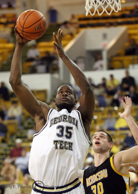 Yellow Jackets F Zachery Peacock goes up strong against Owls F Jon-Michael Nickerson