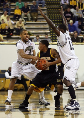 Jackets G Miller and G Bell double team Owls G Dixon at mid-court