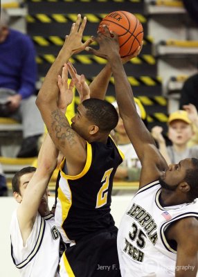 Georgia Tech F Peacock blocks a shot by Kennesaw State F Cummings as Tech C Sheehan fronts him