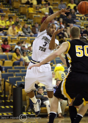 Georgia Tech G Miller makes a jump pass over the Owls defense