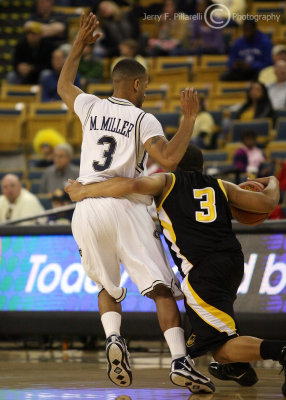 Georgia Tech G Miller moves his feet to get in front of Kennesaw State G Kelvin McConnell