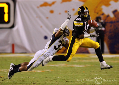 Yellow Jackets CB Jerrard Tarrant leaps to try to break up a pass to Hawkeyes WR Derrell Johnson-Koulianos