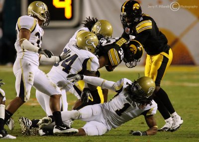Jackets defenders close the hole on Hawkeyes RB Robinson