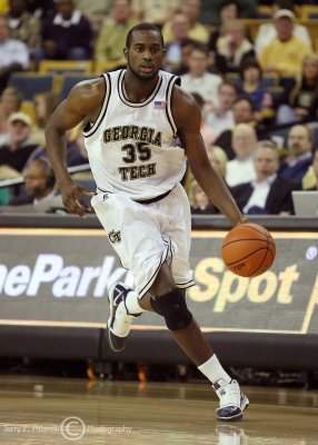 Tech F Peacock brings the ball up court along the sideline