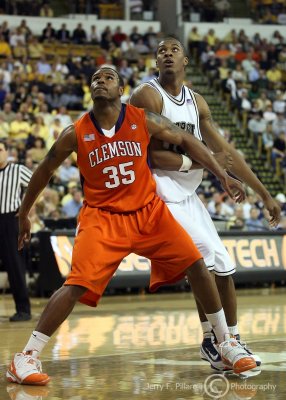 Georgia Tech F Favors is boxed out by Clemson F Trevor Booker as they both look for a rebound off of a free throw attempt