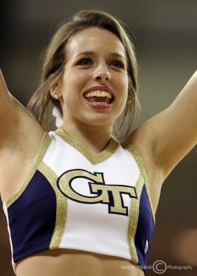 Georgia Tech Yellow Jackets Cheerleader leads the fans in a cheer