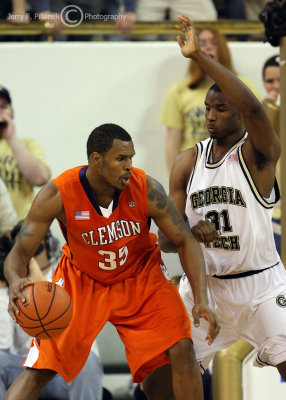 Yellow Jackets F Lawal works to stop Tigers F Trevor Booker