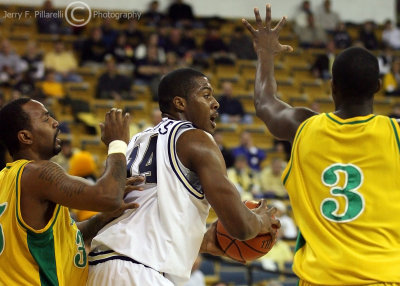Yellow Jackets F Derrick Favors looks to pass out of a double team