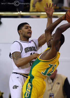 Georgia Tech G Lance Storrs puts heavy pressure on Kentucky State G Julian Brown