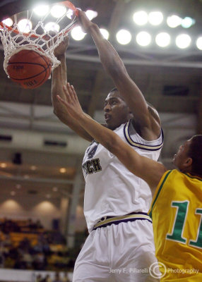 Jackets F Favors finishes strong with a dunk against Thorobreds F Jabari Wright