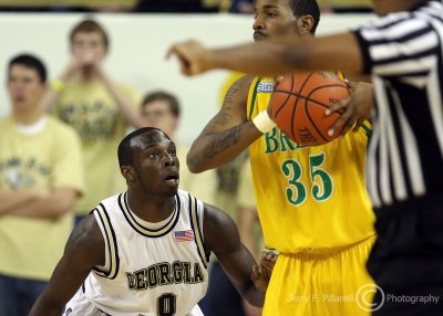 Georgia Tech G Udofia gets low to guard Kentucky State G Johnson