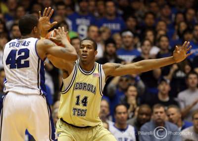 Yellow Jackets F Favors squares up to defend Blue Devils F Lance Thomas