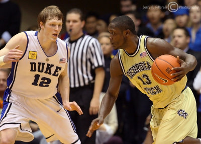Jackets G DAndre Bell looks to make a move around Blue Devils F Kyle Singler