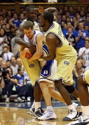 Yellow Jackets G Bell and F Zachary Peacock tie up Blue Devils G Scheyer