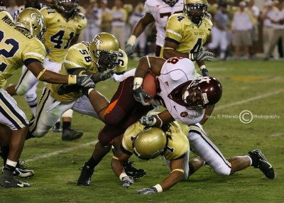 Hokies TB Ore gets hit high by LB Gary Guyton and low by S Morgan Burnett