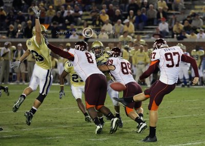 GT S Troy Garside leaps to attempt a block of a VT Brent Bowden punt
