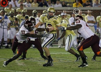 Jackets QB Bennett is surrounded by the Hokies defense