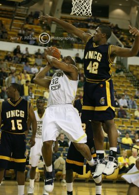 GT F Smith attempts a shot with UNCG F Kyle Hines defending