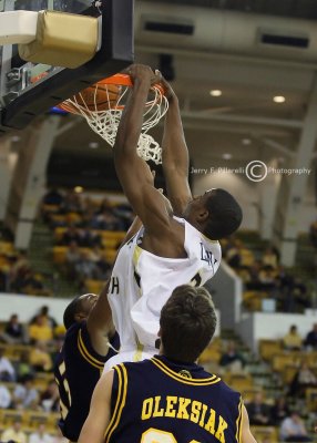 Tech F Gani Lawal dunks over the Spartans defense