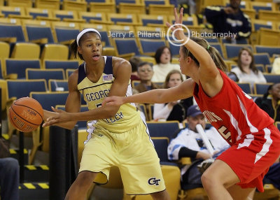 Tech F Montgomery looks for a passing lane around a Wildcats defender