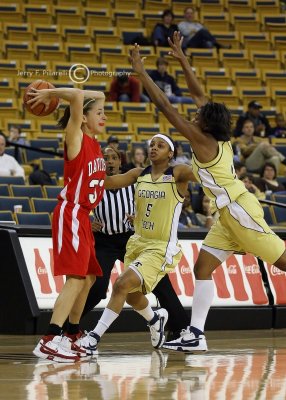 Wildcats G Kelly Gassie looks to pass against the Tech defensive pressure