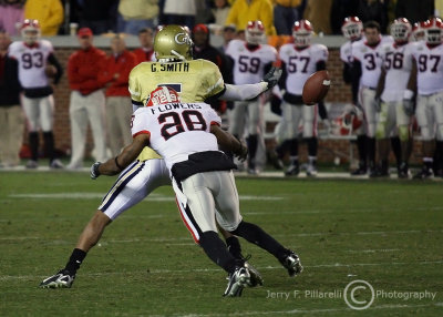 GT WR Greg Smith lets a pass slip through his hands as UGA SC Thomas Flowers makes the hit
