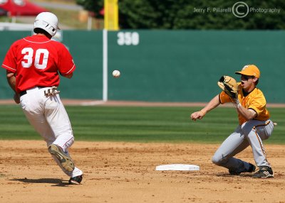 Tennessee 2B Andy Simunic awaits the throw from the plate…