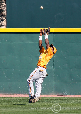 Tennessee CF Kentrail Davis scrambles to catch a fly ball