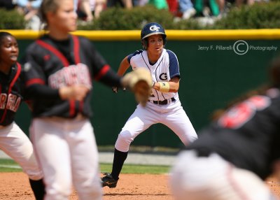 Georgia Tech OF Stephanie Butler and the Georgia infield move on the pitch