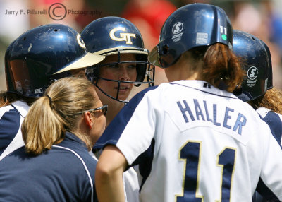 Tech Coach Perkins instructs her hitter and base runners during a time out