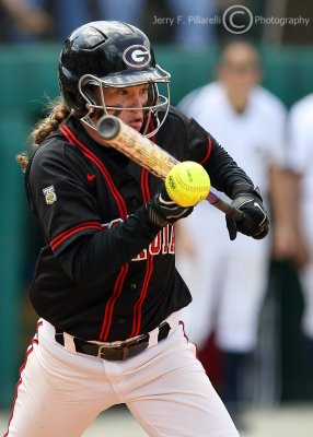 A Georgia player attempts to lay down a bunt