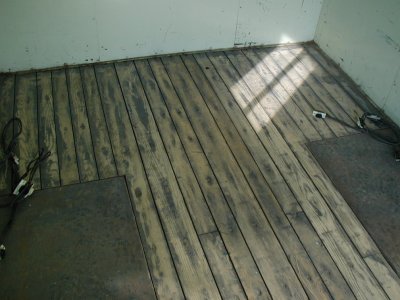 The oak floor after some sanding . . . more sanding yet to happen