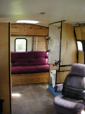 view from the passenger's side front looking to the rear. The bathroom stall is still being built