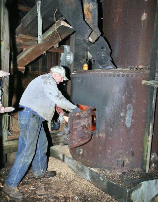 Gene feeding the boiler --------- IMG_0844a.jpg