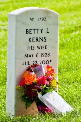 Flowers and cards laid at the grave site.