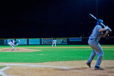 One of the Aces' pitchers threw underhanded, so I tried a shot through the fence.