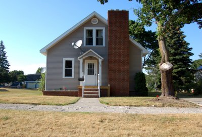 This isn't really connected to the ROBINSON's, other than it was, Lucille Alena [Mattson] Robinson's girlhood home in Newberry. This is how the house looks today, or at least as it looked, 04 July 2007, when we took our daughter, Hazelmarie Alena Rosina Mann, home to meet her Michigan family. This is the same house where Harold & Lucille were pictured earlier. Much earlier, like say, sixty three years earlier.   