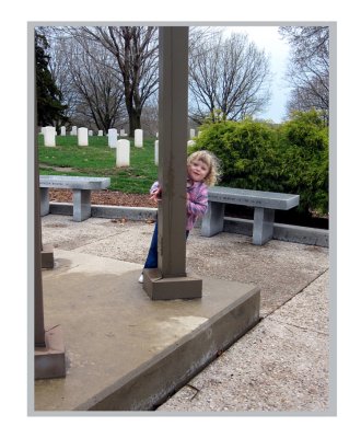 My daughter, Hazelmarie, playing peek-a-boo around the pavillion.