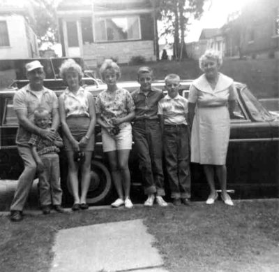 This shot was taken around 1965. From left to right we can see, Harold Everette Robinson, David Arthur, JoAnne Esther, Sandra Lee, Roy Raymond, Harold Everett Robinson II & Lucille Alena [Mattson] Robinson. This shot was donated by Harold's daughter, Amy Lynn [Robinson] Piar.